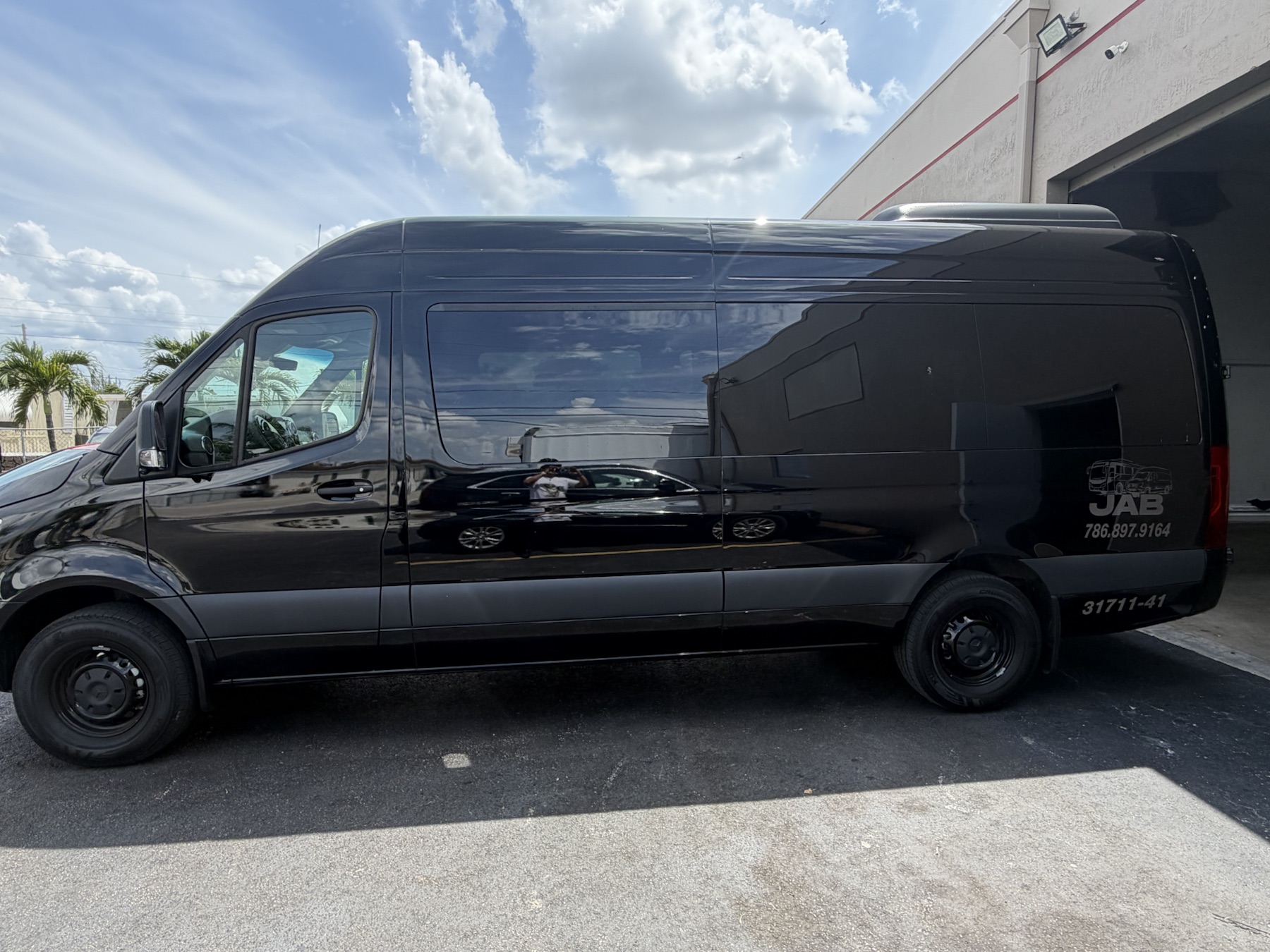 Black Mercedes-Benz Sprinter van ready for private service